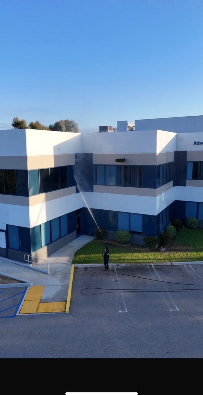 Multi-story commercial building exterior washing